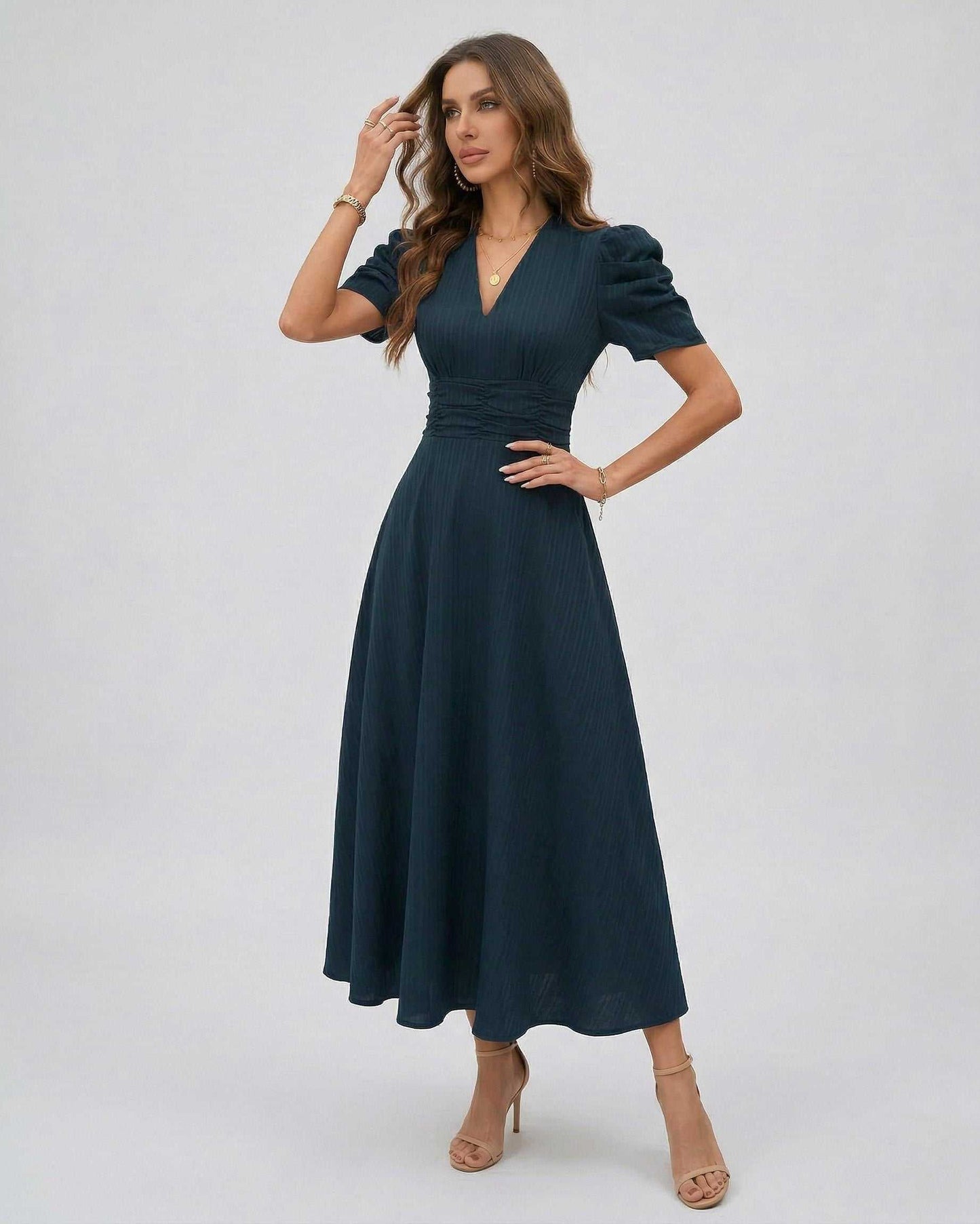 Orion Midi Dress featuring dark teal color, flattering V-neckline, puff sleeves, and elegant structure by Lauven.