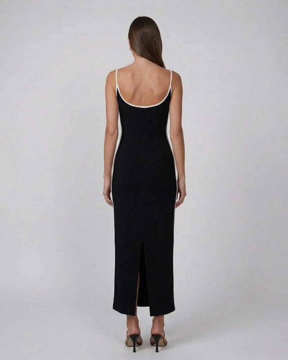 Orion Midi Dress by Lauven - Back view of sleek black slim fit dress with contrast piping and side slit.