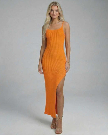 Orion Midi Dress by Lauven in vibrant orange, showcasing a sleek knitted design with a high slit.