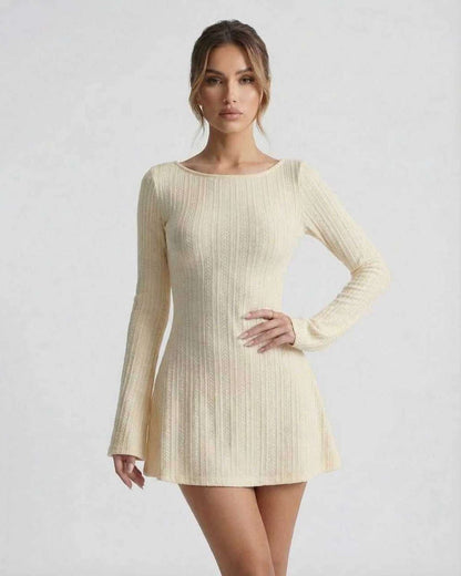 Orion Mini Dress - Elegant long sleeve cable knit mini dress by Lauven, featuring a soft cream tone and a cozy silhouette.