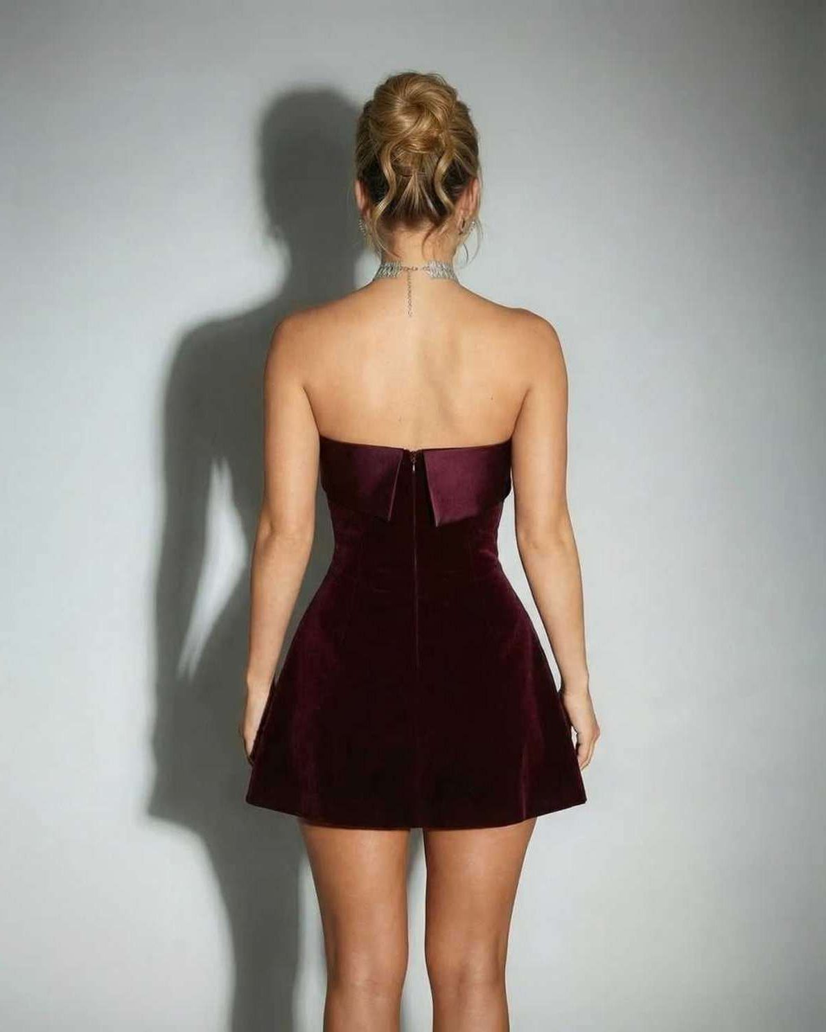 Orion Mini Dress by Lauven, luxurious strapless burgundy velvet silhouette with a sleek feel and refined elegance.