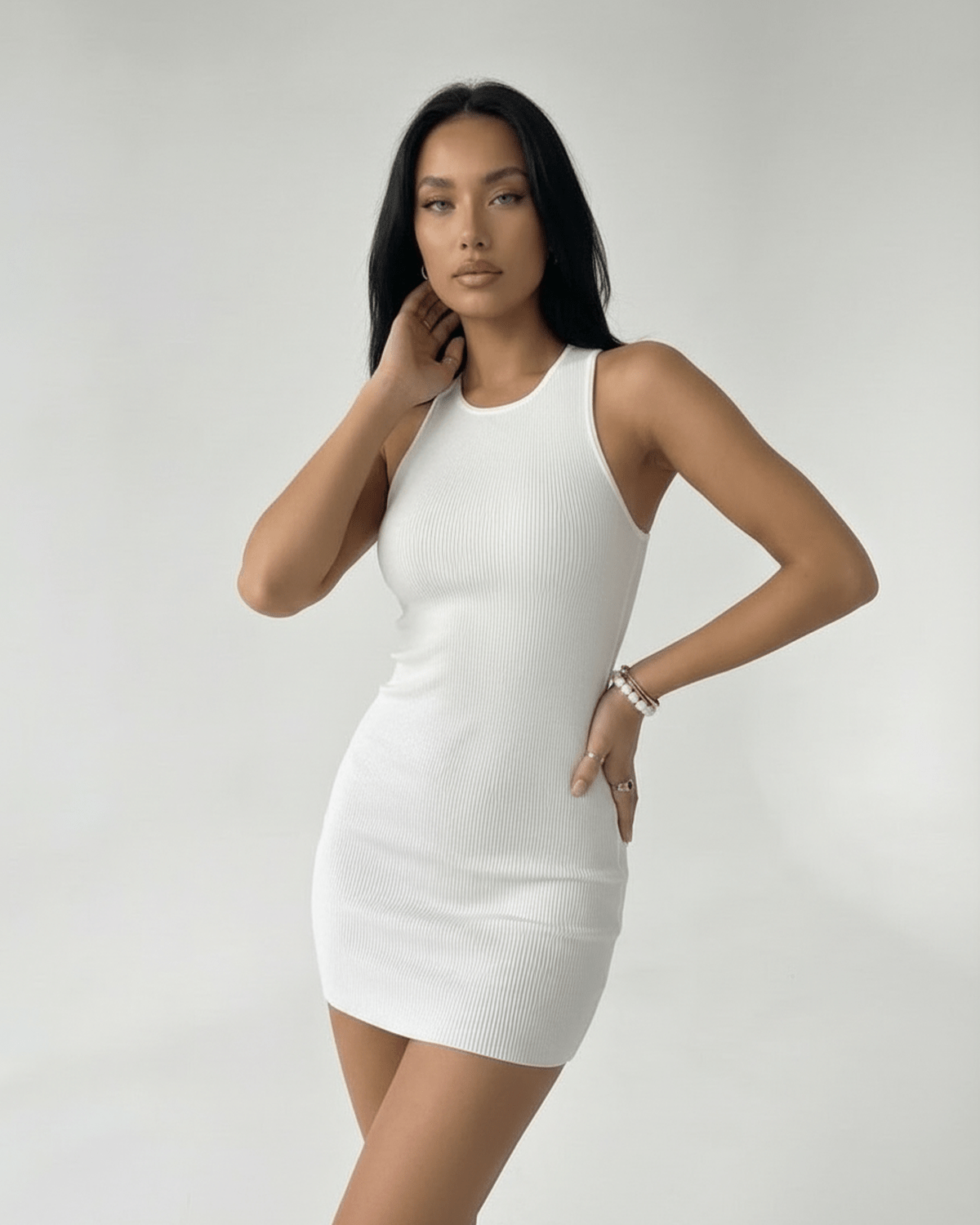 Orion Mini Dress by Lauven - Stylish ribbed knit white mini dress with a sleeveless design and cross back detail.