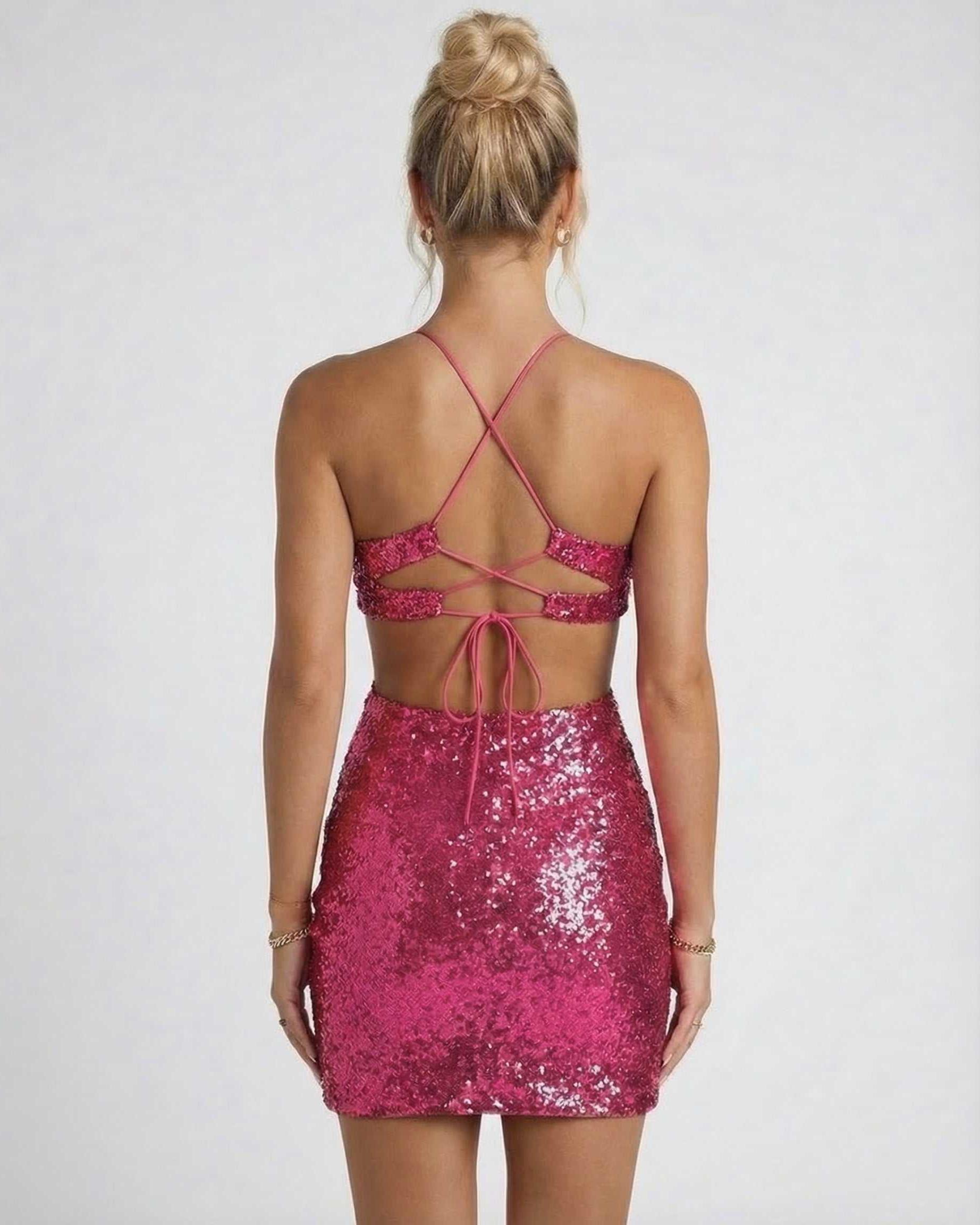 Back view of the Lauven Orion Mini Dress, a sleeveless sequined magenta party dress with stylish crisscross straps.