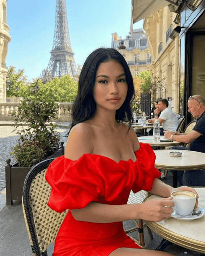 Model wearing Oriona Mini Dress by Lauven, a luxurious red satin bodycon dress perfect for elegant outings.