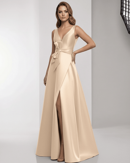 Orlena Maxi Dress – Champagne satin A-line with wrap slit, bow waist, and elegant silhouette from Lauven.