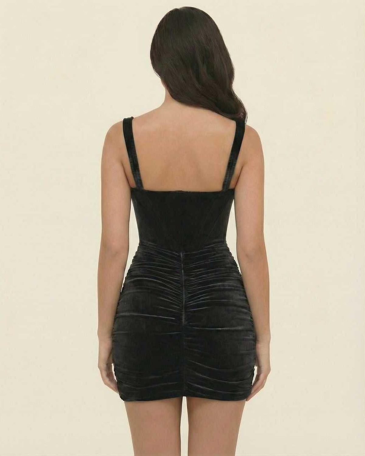 Back view of Lauven Nova Mini Dress in elegant black velvet, highlighting the asymmetrical design and slim fit.