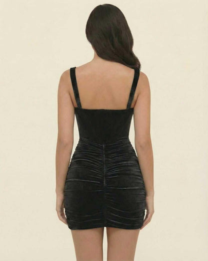Back view of Lauven Nova Mini Dress in elegant black velvet, highlighting the asymmetrical design and slim fit.
