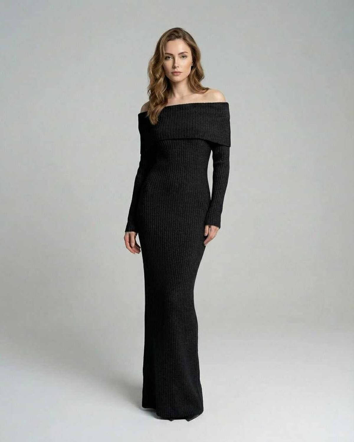 Model wearing the Noir Maxi Dress by Lauven, featuring an off-shoulder neckline and ribbed fabric.