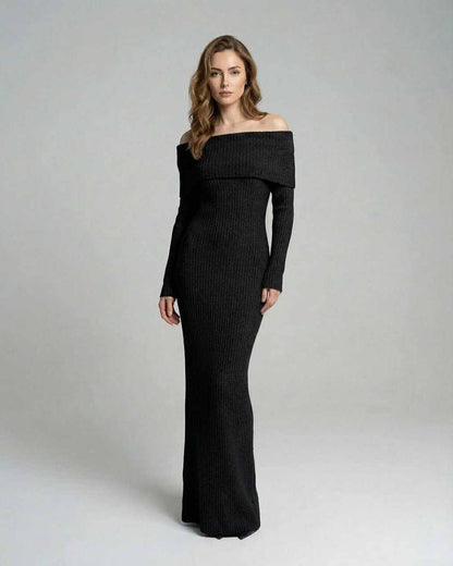 Model wearing the Noir Maxi Dress by Lauven, featuring an off-shoulder neckline and ribbed fabric.