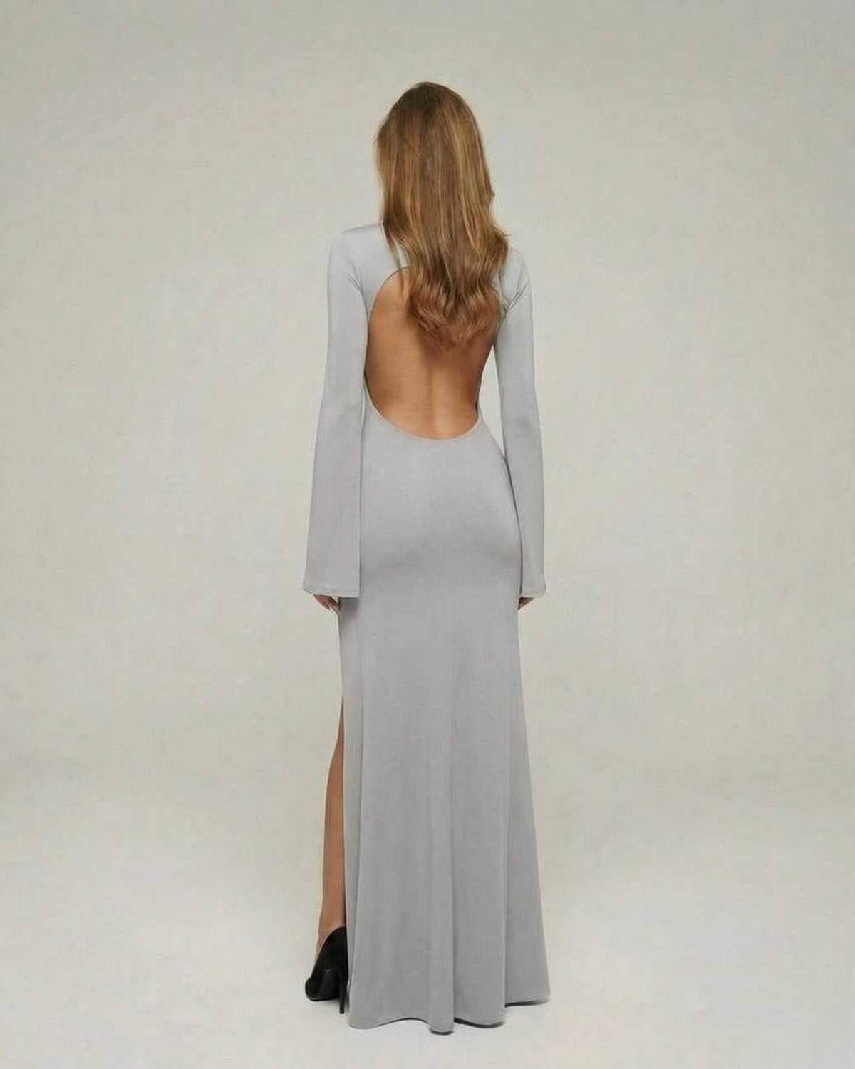 Back view of the Lunara Maxi Dress by Lauven in elegant grey with open back and flare sleeves.