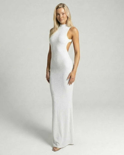 Lunara Maxi Dress by Lauven, a sleek white backless evening gown with a shimmering finish and modern design.