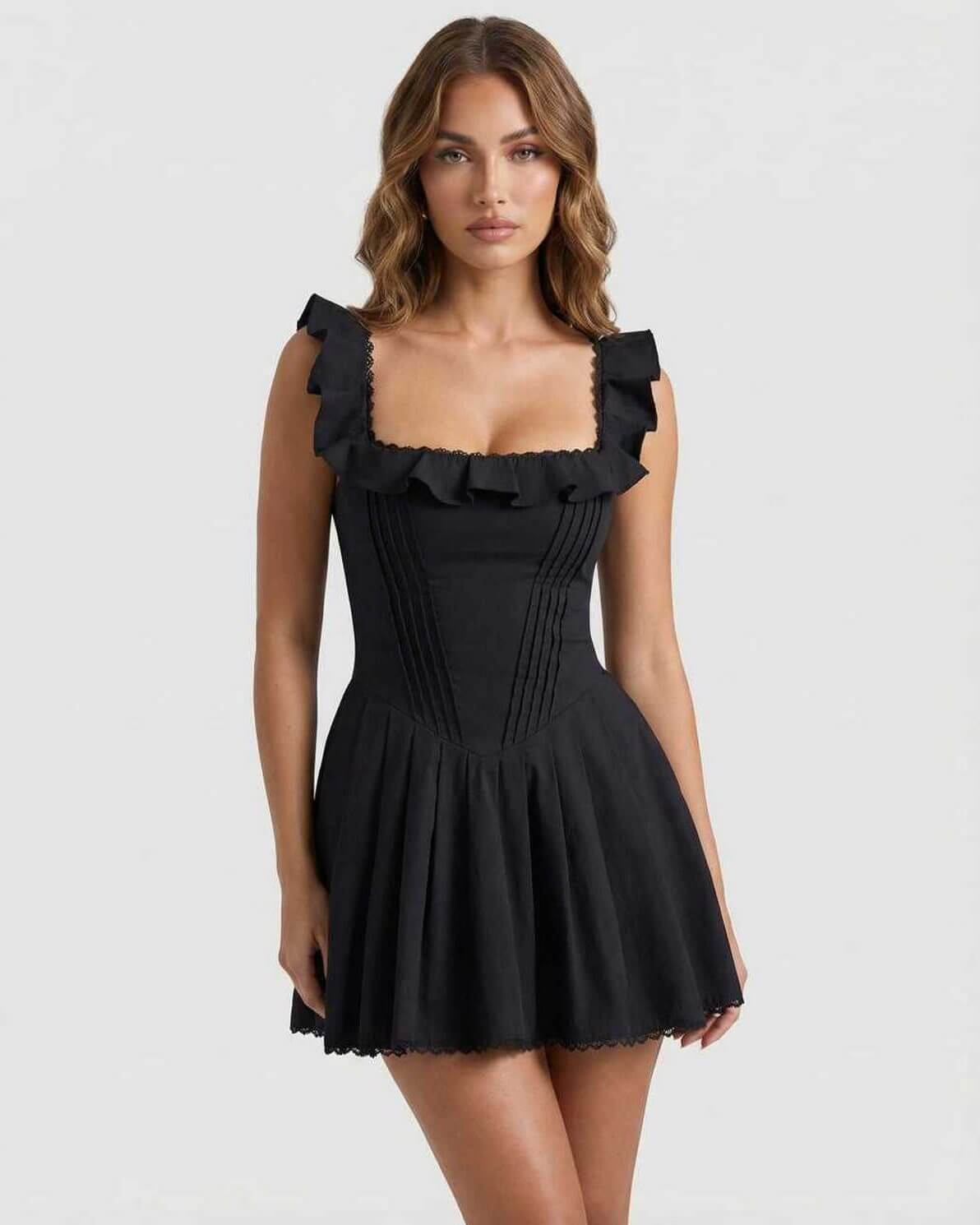 Serena Mini Dress by Lauven – Sleek black cotton blend with ruffle details, perfect for club style.