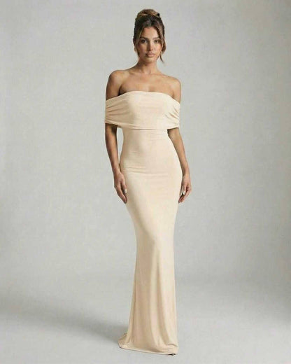 Soleil Maxi Dress by Lauven, soft nude off-shoulder silhouette with a sleek form-fitting design.