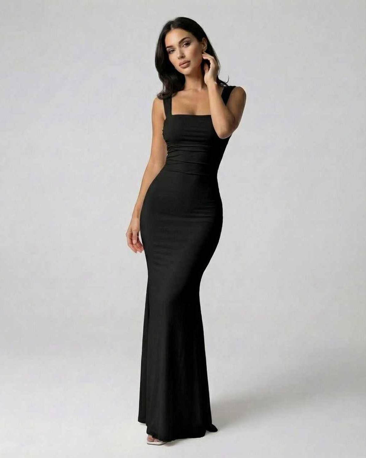 Onyx Maxi Dress by Lauven, elegant black strappy back silhouette, ankle-length fit, smooth knitted fabric.