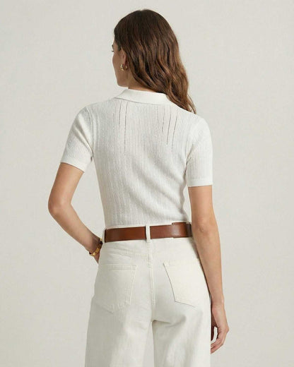 Back view of a woman wearing the Lauven Monaco Polo Shirt in white ribbed cotton knit.