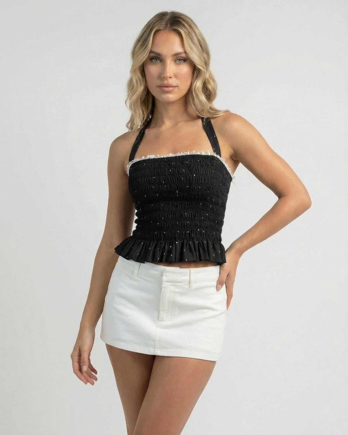 Luna Top by Lauven, women's halter polka dot slim fit ruffle top in black with delicate detailing.