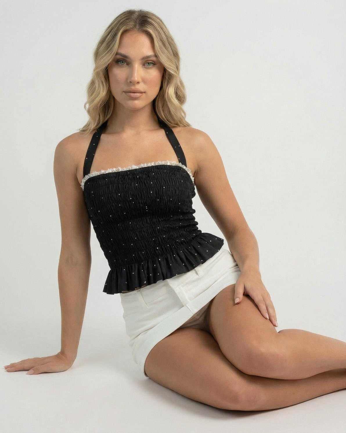 Luna Top by Lauven – Women's halter polka dot slim fit ruffle top in black with stylish details.