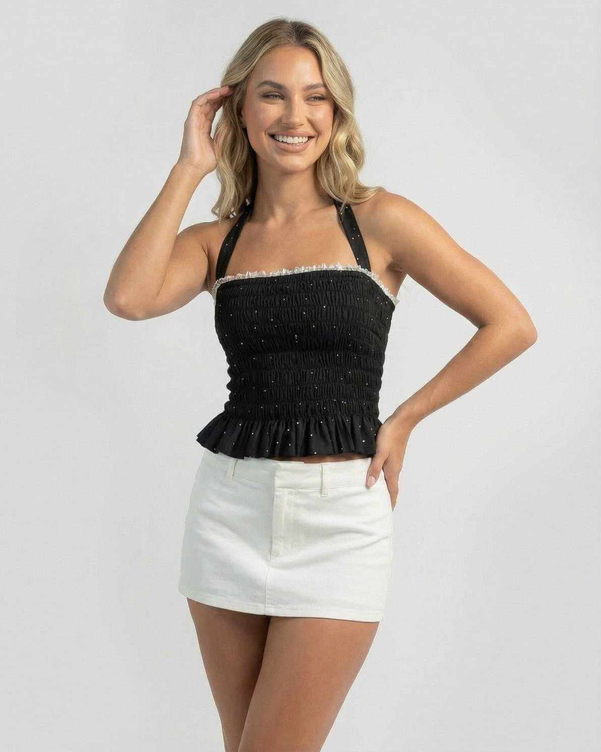 Luna Top - women’s halter polka dot slim fit ruffle top by Lauven, perfect for day-to-night styling with playful elegance.