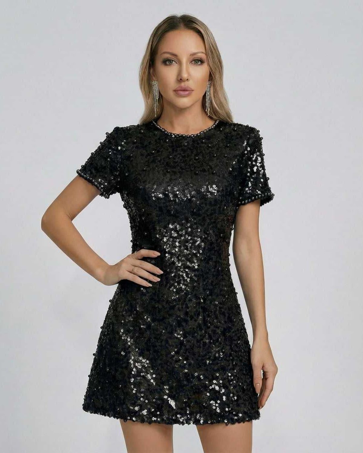 Nova Mini Dress by Lauven in classic black with sequin detail and elegant A-line silhouette.