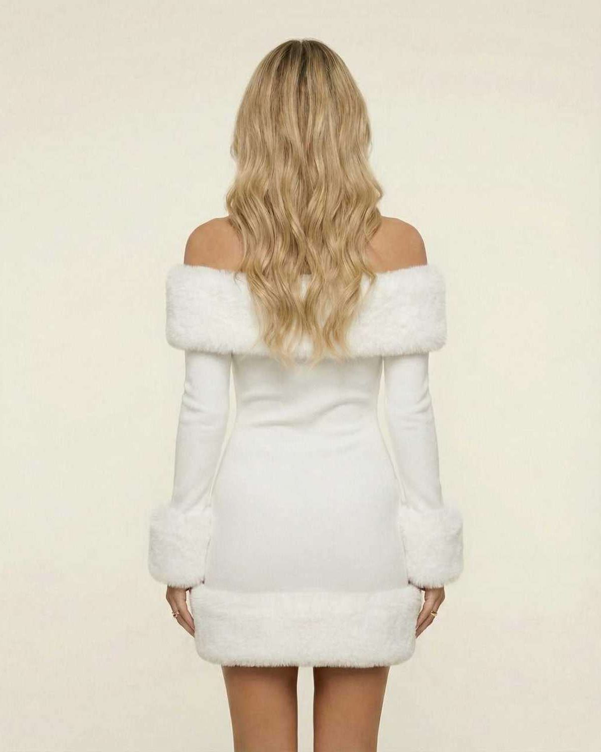 Back view of the Nova Mini Dress by Lauven, featuring luxe faux fur trim in crisp white.