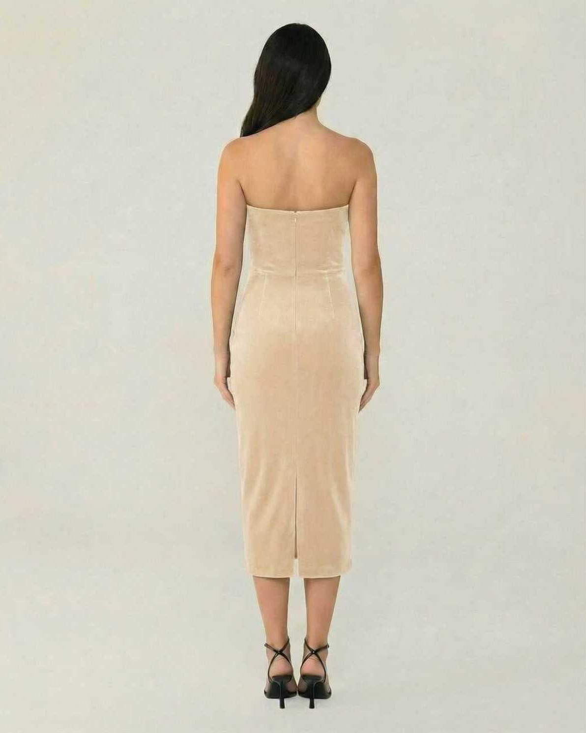 Back view of the Luna Midi Dress by Lauven, showcasing its elegant beige velvet design and form-fitting silhouette.
