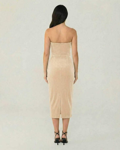 Back view of the Luna Midi Dress by Lauven, showcasing its elegant beige velvet design and form-fitting silhouette.