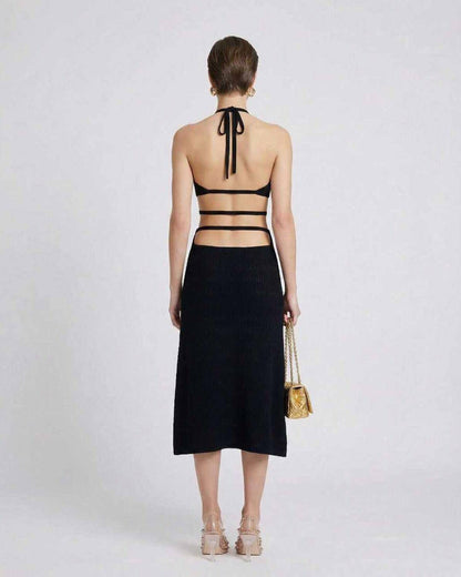 Nova Midi Dress by Lauven – Back view of a sleek black knit dress with sexy A-line silhouette and adjustable straps.