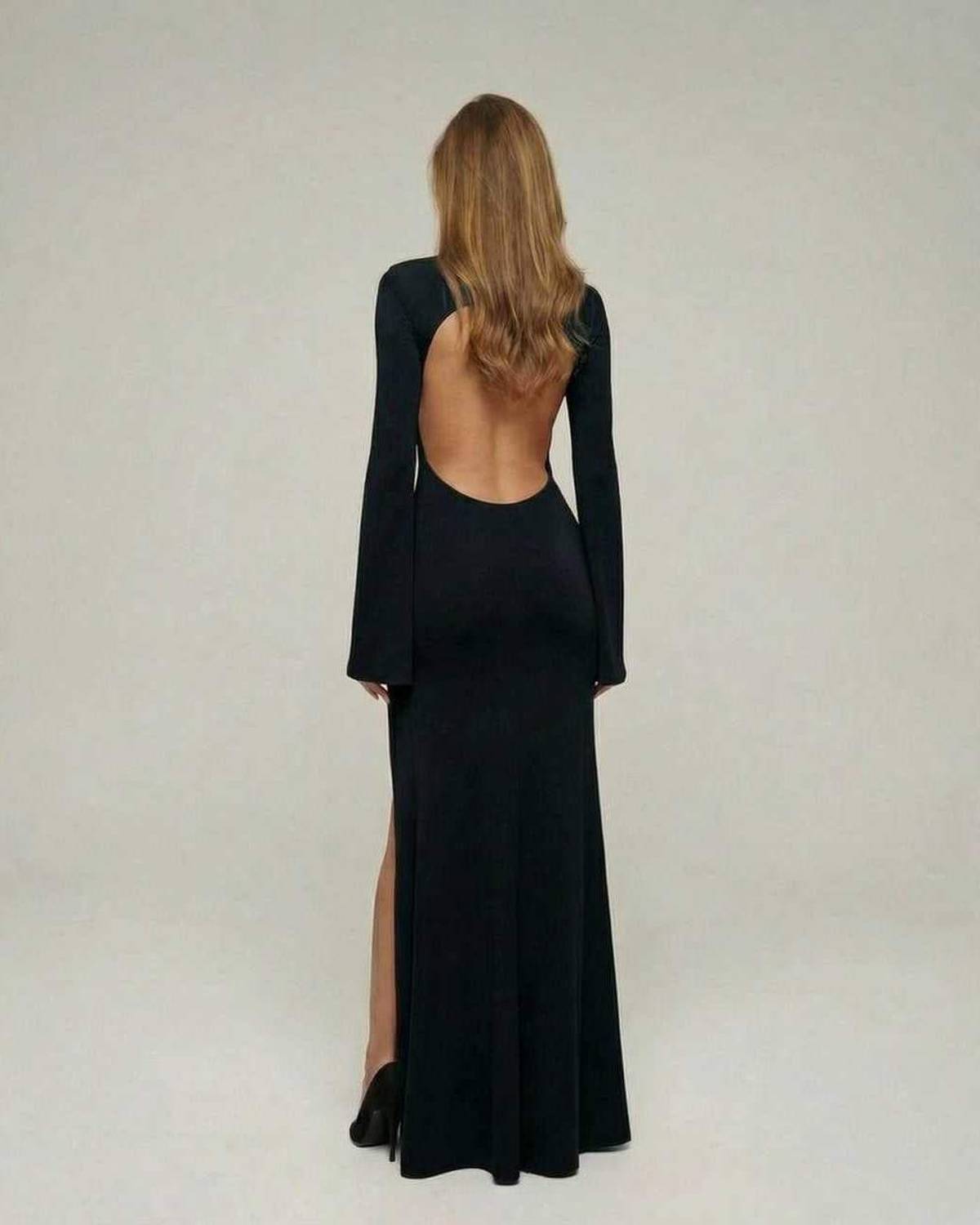 Nerina Maxi Dress by Lauven, black slim fit pencil dress with flare sleeves and open back, showcasing elegant design.