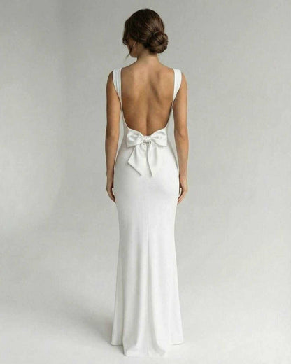 Velora Maxi Dress by Lauven - Elegant back view with bow detail in classic white, showing strappy open back and sleek silhouette.