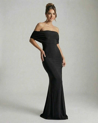 Lauven Noir Maxi Dress featuring an elegant off-shoulder silhouette in classic black, perfect for any formal occasion.