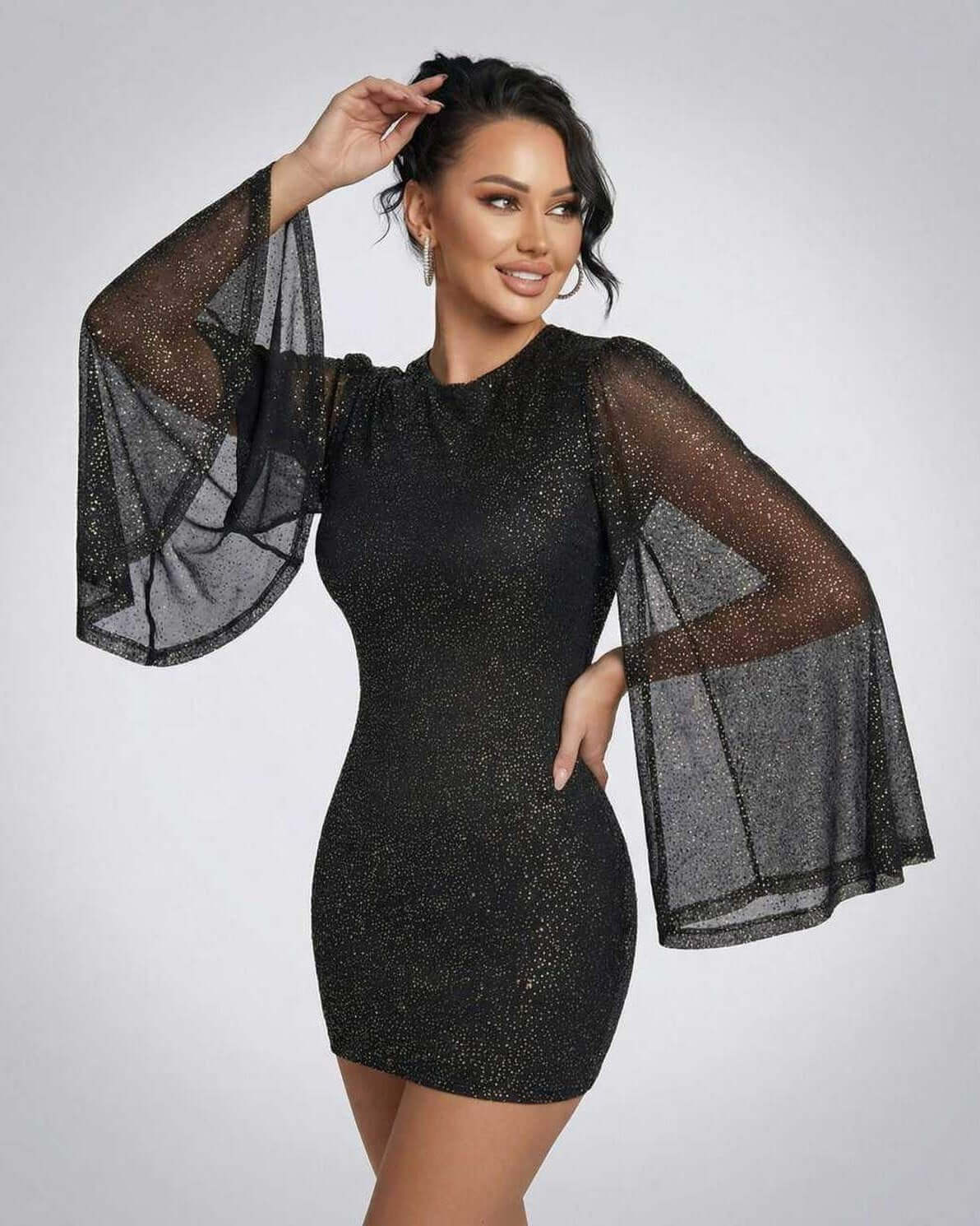 Celeste Mini Dress by Lauven, featuring sheer cloak sleeves and a sparkling dot pattern for an elegant look.
