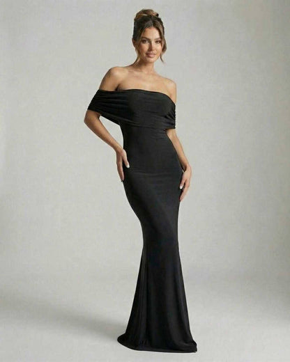 Noir Maxi Dress by Lauven, elegant off-shoulder black dress with ruched detailing and floor-length silhouette.