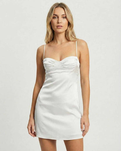 Nova Mini Dress by Lauven, featuring a classic white satin sheath with thin spaghetti straps and a structured bodice.