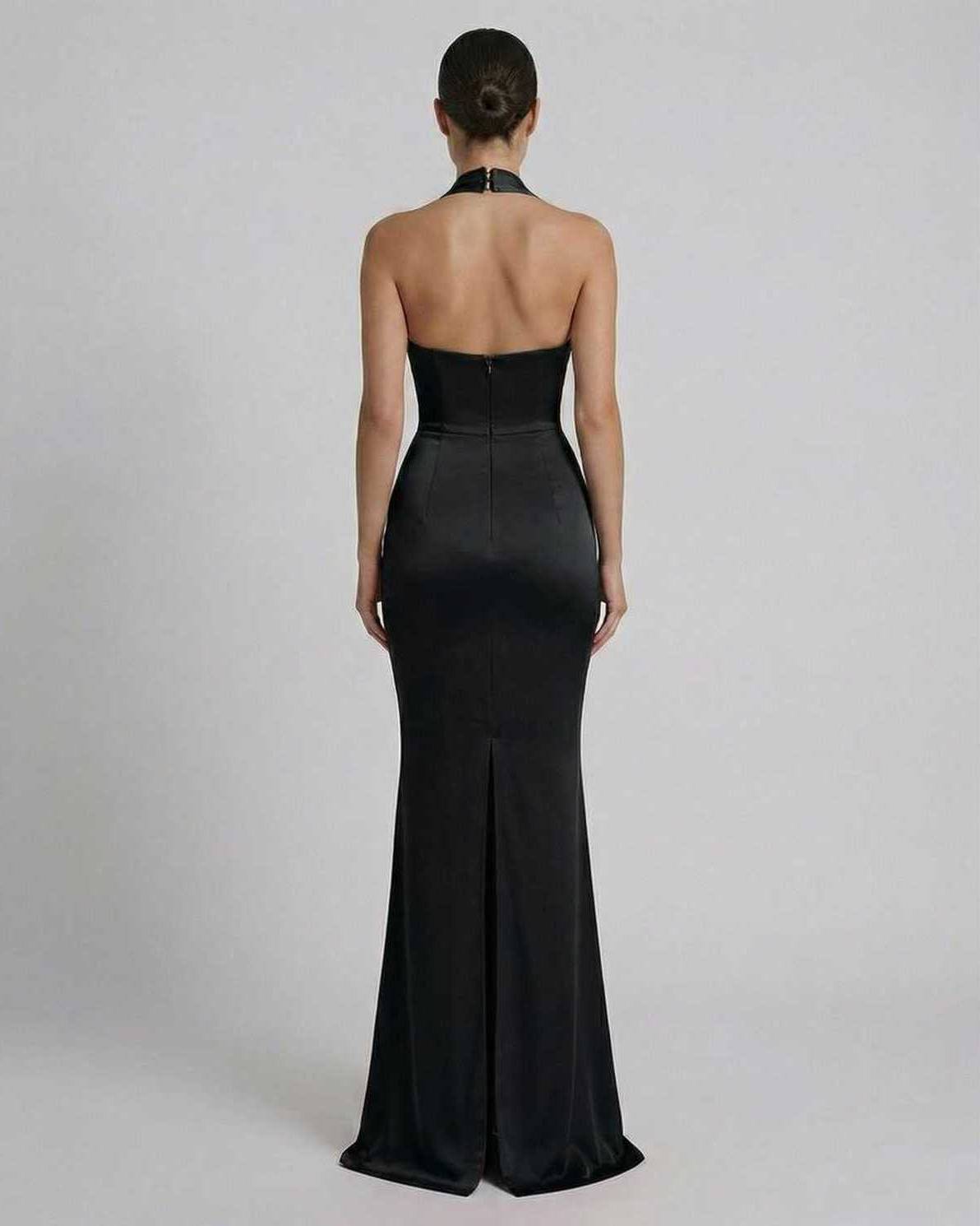 Back view of the elegant Maris Maxi Dress by Lauven, showcasing its sleek black satin design and flattering silhouette.