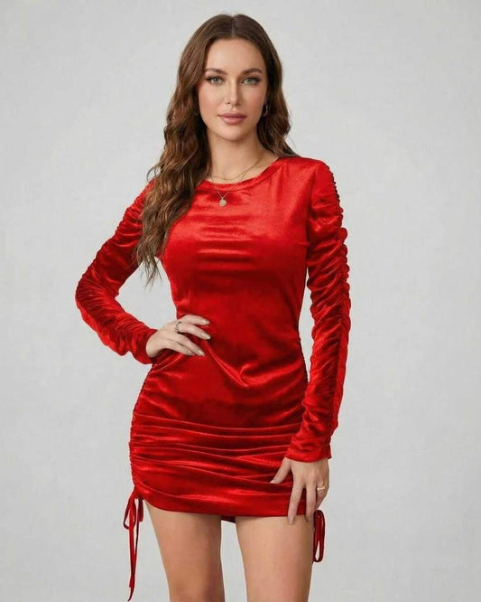 Aurora Mini Dress by Lauven features a vibrant red velvet design with long ruched sleeves and a flattering bodycon fit.