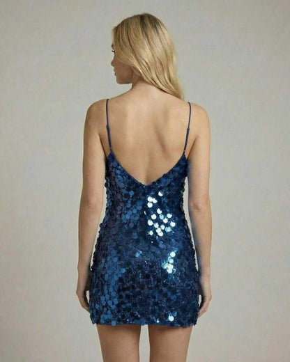 Nova Mini Dress by Lauven in navy blue sequins, showcasing a fitted bodycon silhouette from the back.