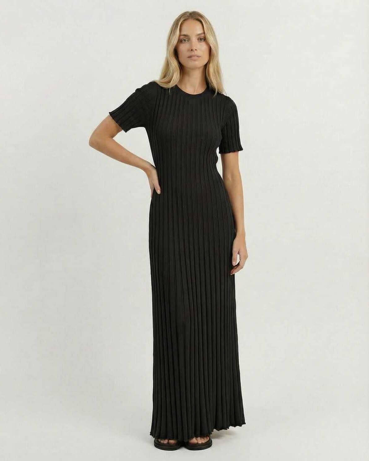 Luna Maxi Dress by Lauven, elegant black ribbed knit maxi dress featuring fitted bodice and short sleeves.