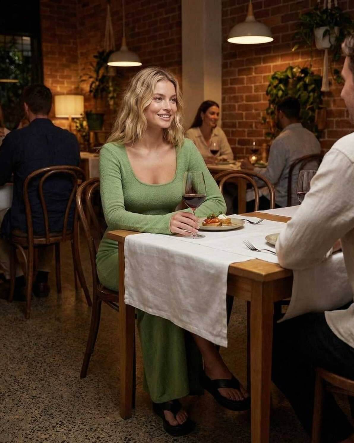 Verde Maxi Dress by Lauven, long sleeve slim fit dress with side slit, worn at a stylish dinner setting.