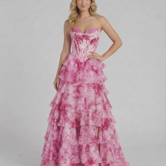 Rosalia Maxi Dress by Lauven features a pink floral chiffon gown with tiered ruffles and a corset bodice.