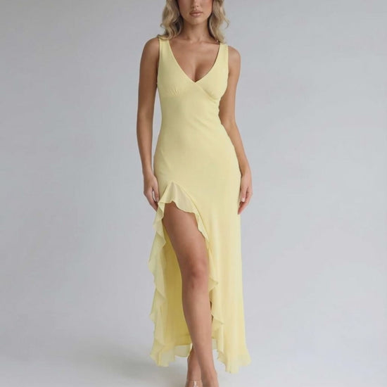 Solara Maxi Dress - Yellow with ruffle slit, flowing silhouette, and elegant design by Lauven. Perfect for summer and formal occasions.