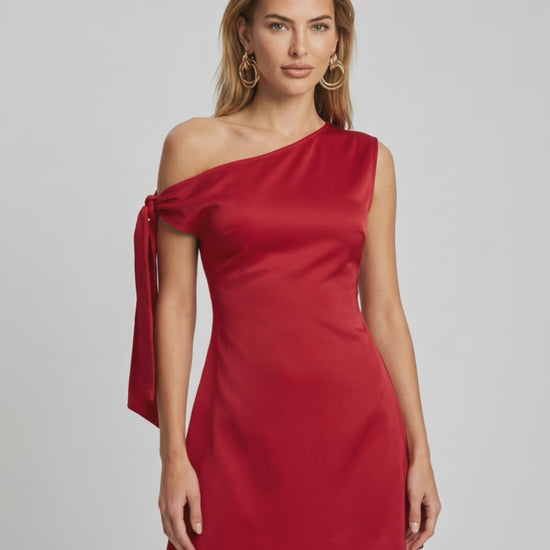 Veloura Mini Dress in red satin, featuring asymmetric neckline and A-line silhouette by Lauven.