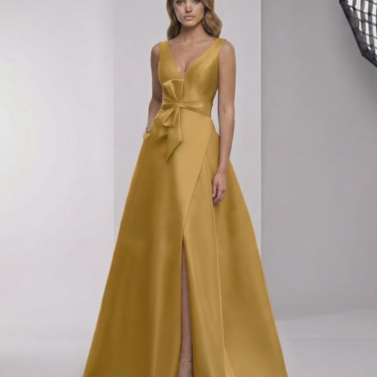 Solenne Maxi Dress - Luxurious satin A-line dress with wrap slit, bow detail, and elegant golden hue by Lauven.
