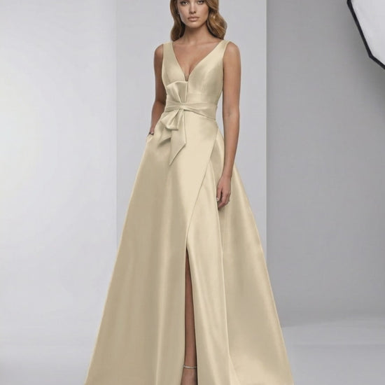 Celeste Maxi Dress in champagne satin, featuring A-line silhouette, V-neckline, and elegant floor-length design by Lauven.