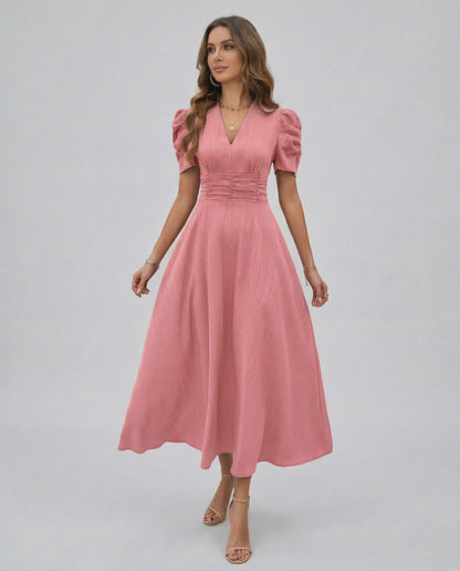 Elara Midi Dress in soft pink with V-neckline, puffed sleeves, and cinched waist by Lauven for elegant occasions.