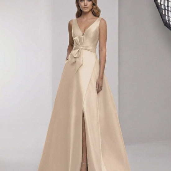 Orlena Maxi Dress - Champagne satin A-line dress with wrap slit, bow waist, and elegant V-neck by Lauven.