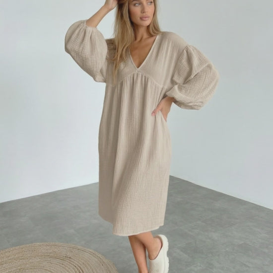 Calista Midi Dress in beige cotton with puff sleeves, embodying modern minimalism and everyday elegance by Lauven.
