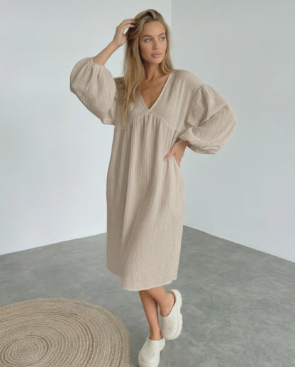 Calista Midi Dress in beige cotton with puff sleeves, embodying modern minimalism and everyday elegance by Lauven.