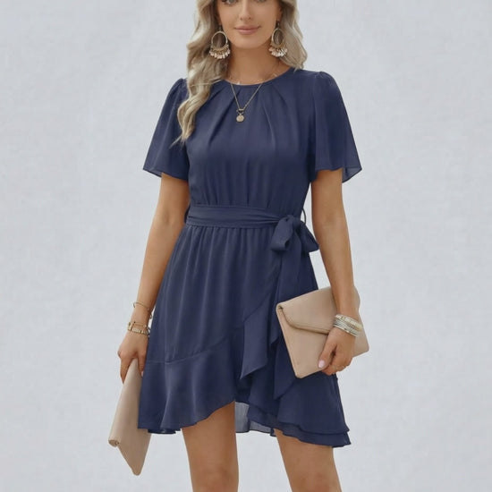 Navy Ruffle Dress by Lauven, featuring flutter sleeves and a flattering waist tie for sophisticated style.
