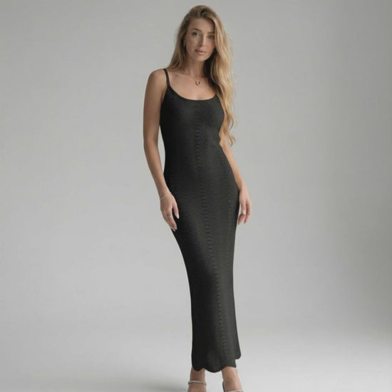 Noiré Midi Dress showcasing a black bodycon design with sleek silhouette, embodying modern sophistication by Lauven.