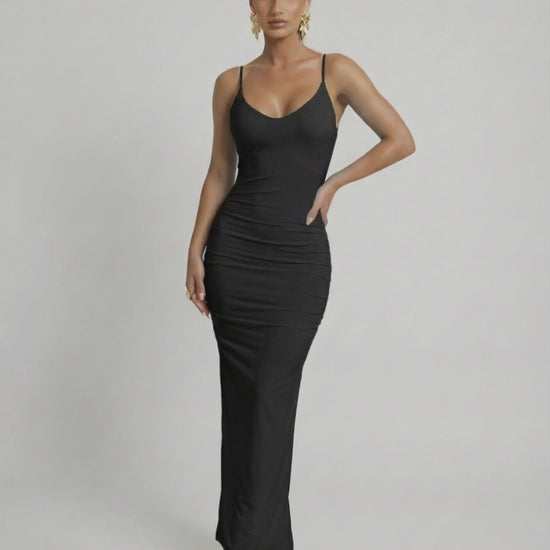 Lauven Noir Maxi Dress, sleek black sleeveless bodycon with spaghetti straps and deep backless cut.